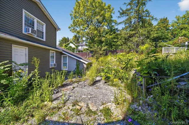 a view of a house with a tree