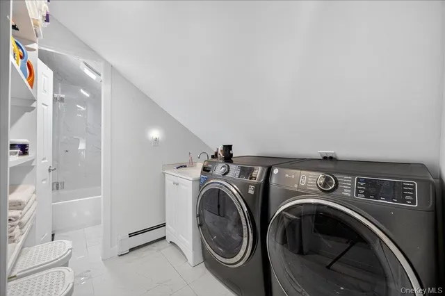 a utility room with dryer and washer