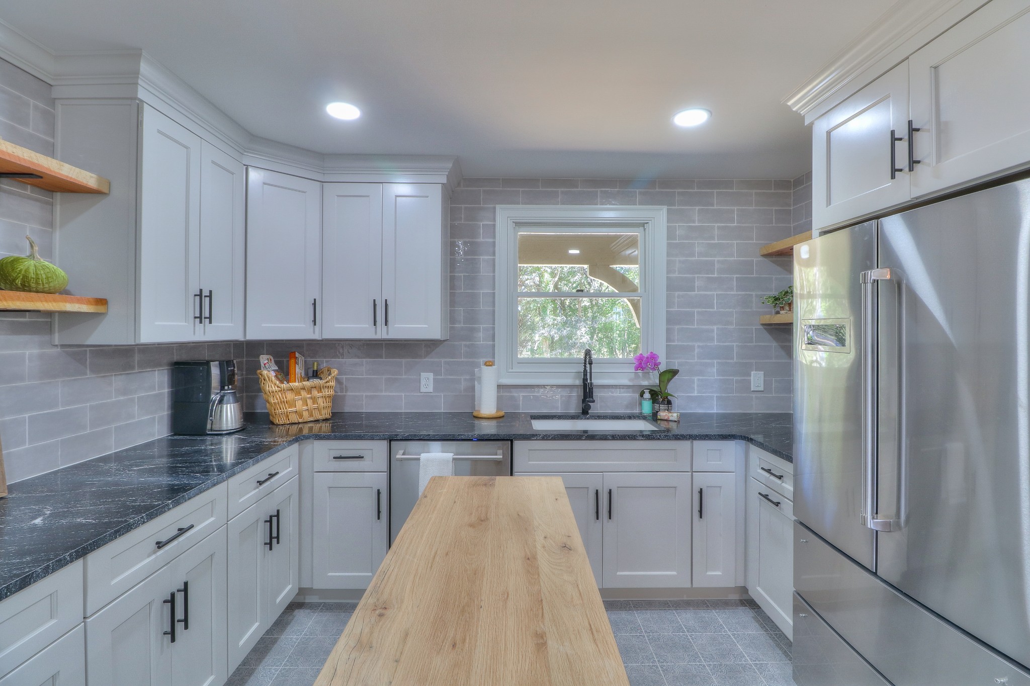 653 Flippen Road Lebanon, TN 37087 - Photo 12 of 49 a kitchen with white cabinets and sink