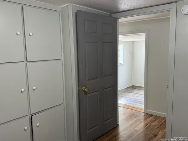 a bathroom with a bathtub shower sink vanity and toilet