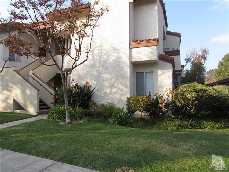 1742 Sinaloa Road, Unit 344 Simi Valley, CA 93065 - Photo 1 of 20 a backyard of a house with plants and large tree