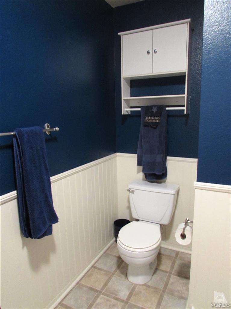 1742 Sinaloa Road, Unit 344 Simi Valley, CA 93065 - Photo 12 of 20 a bathroom with a toilet a sink and mirror