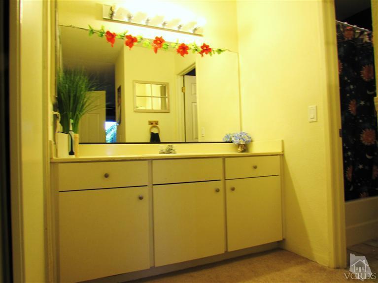 1742 Sinaloa Road, Unit 344 Simi Valley, CA 93065 - Photo 6 of 20 a bathroom with a sink and mirror