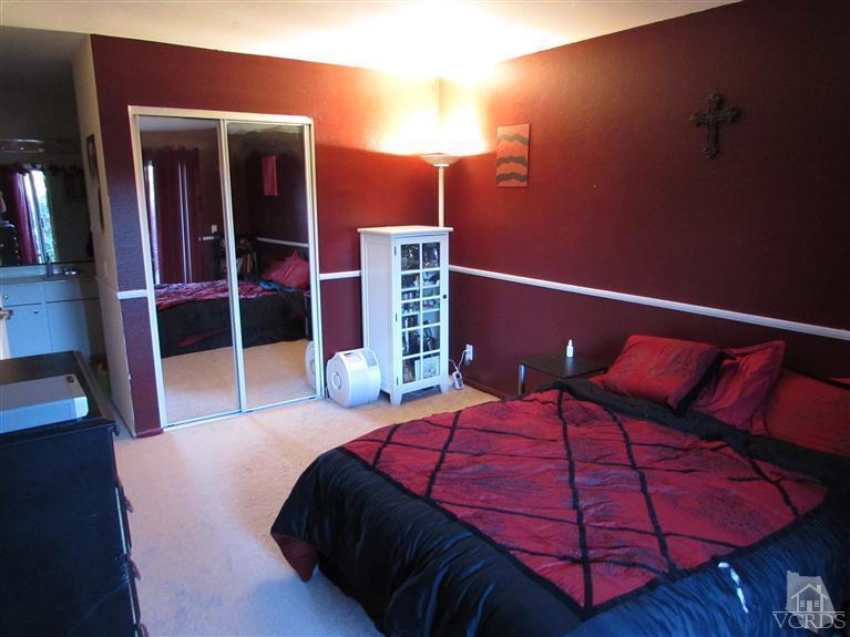 1742 Sinaloa Road, Unit 344 Simi Valley, CA 93065 - Photo 8 of 20 a bedroom with a bed and wooden floor