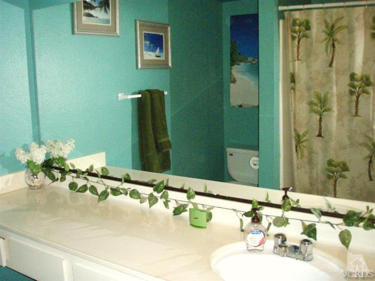 1742 Sinaloa Road, Unit 344 Simi Valley, CA 93065 - Photo 9 of 20 a bathroom with a sink and a mirror