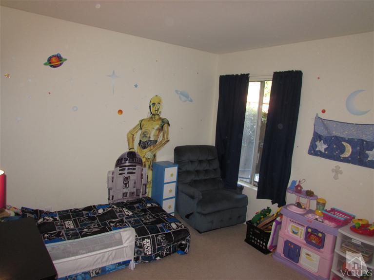 1742 Sinaloa Road, Unit 344 Simi Valley, CA 93065 - Photo 10 of 20 a bedroom with a bed and wooden floor