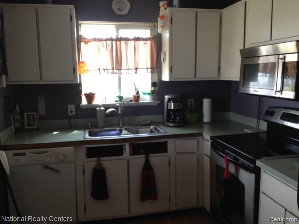 897 Chase Lake Road Howell, MI 48855 - Photo 12 of 19 Ample Cabinets.jpg