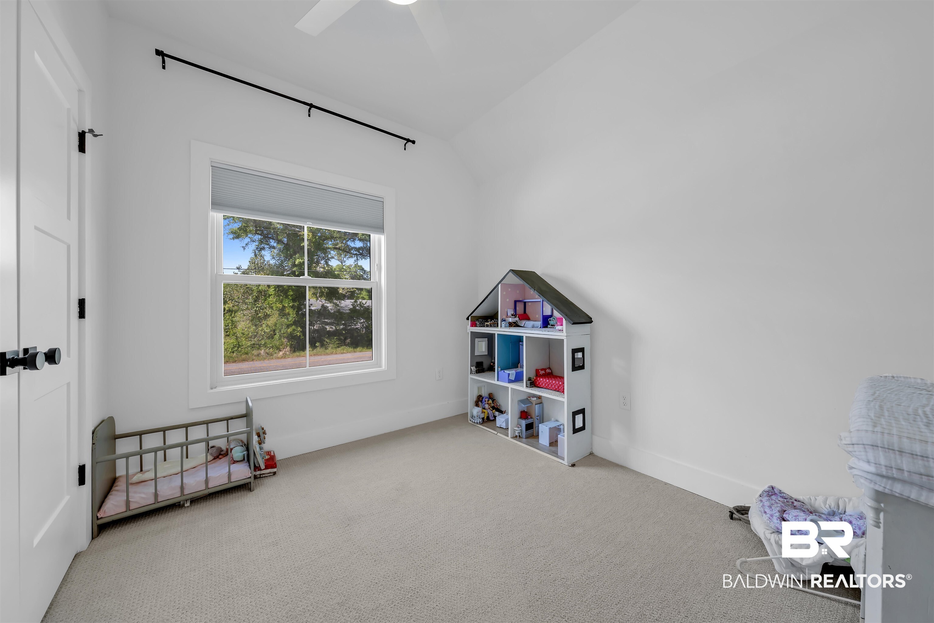 19058 James Road Gulf Shores, AL 36542 - Photo 29 of 49 Recreation room with vaulted ceiling, light colored carpet, and ceiling fan