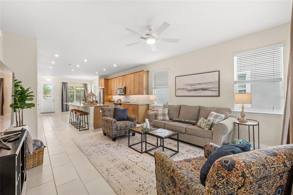 16716 Wingspread Loop Winter Garden, FL 34787 - Photo 14 of 56 a living room with furniture and a large window