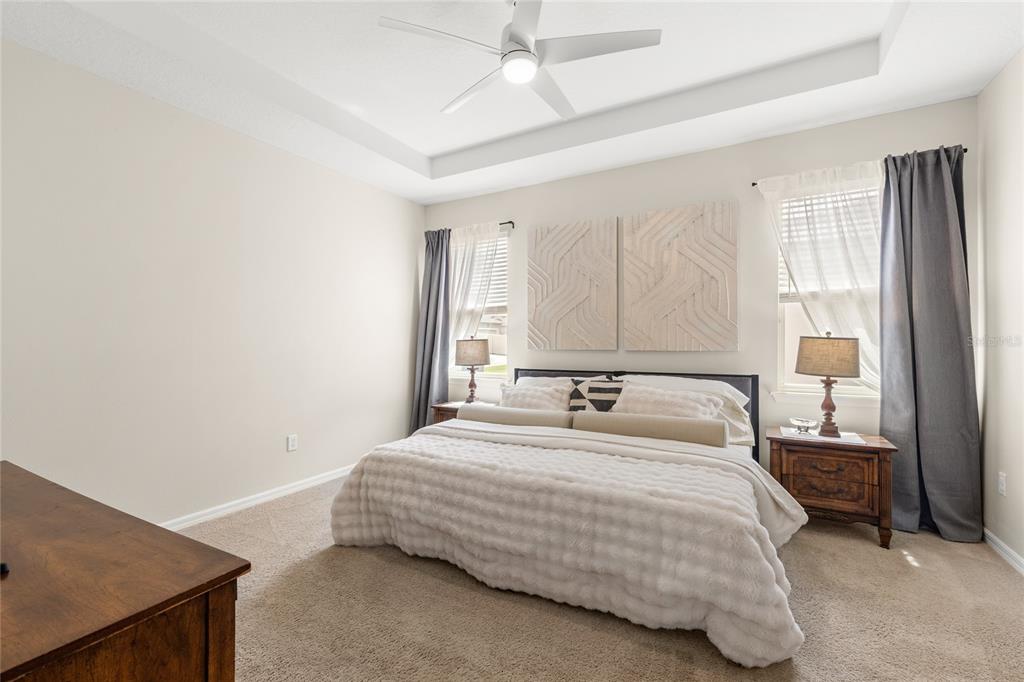 16716 Wingspread Loop Winter Garden, FL 34787 - Photo 18 of 56 a bedroom with a bed and a cabinets