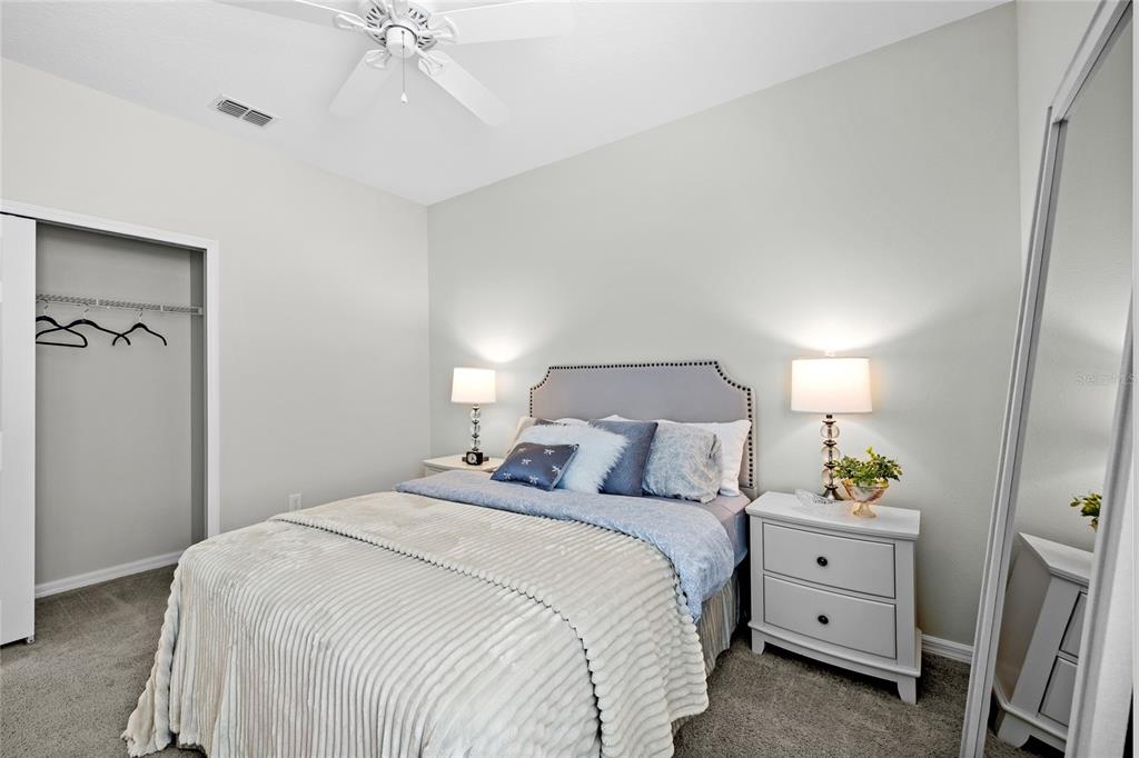 16716 Wingspread Loop Winter Garden, FL 34787 - Photo 24 of 56 a bedroom with a bed and a dresser