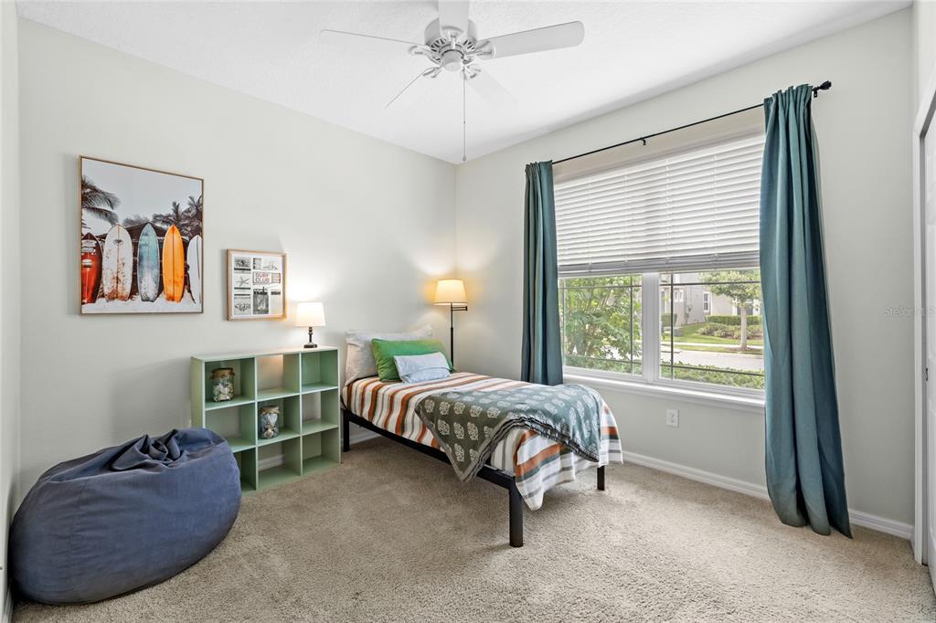 16716 Wingspread Loop Winter Garden, FL 34787 - Photo 26 of 56 a bed room with a bed and a window