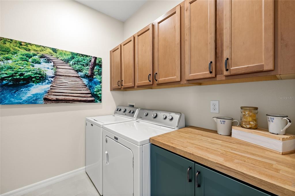 16716 Wingspread Loop Winter Garden, FL 34787 - Photo 28 of 56 a utility room with dryer and washer