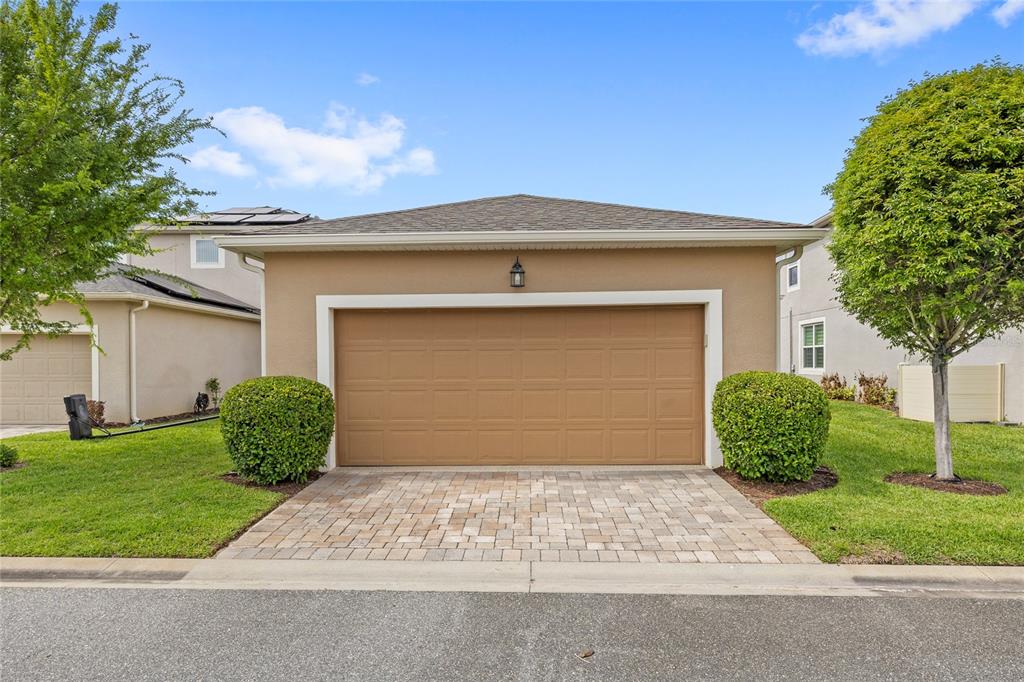 16716 Wingspread Loop Winter Garden, FL 34787 - Photo 34 of 56 a front view of a house with garden