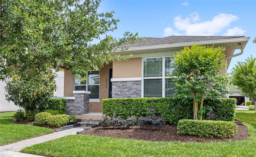 16716 Wingspread Loop Winter Garden, FL 34787 - Photo 39 of 56 a front view of a house with a yard