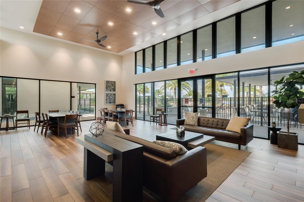 16716 Wingspread Loop Winter Garden, FL 34787 - Photo 48 of 56 a living room with furniture and large windows