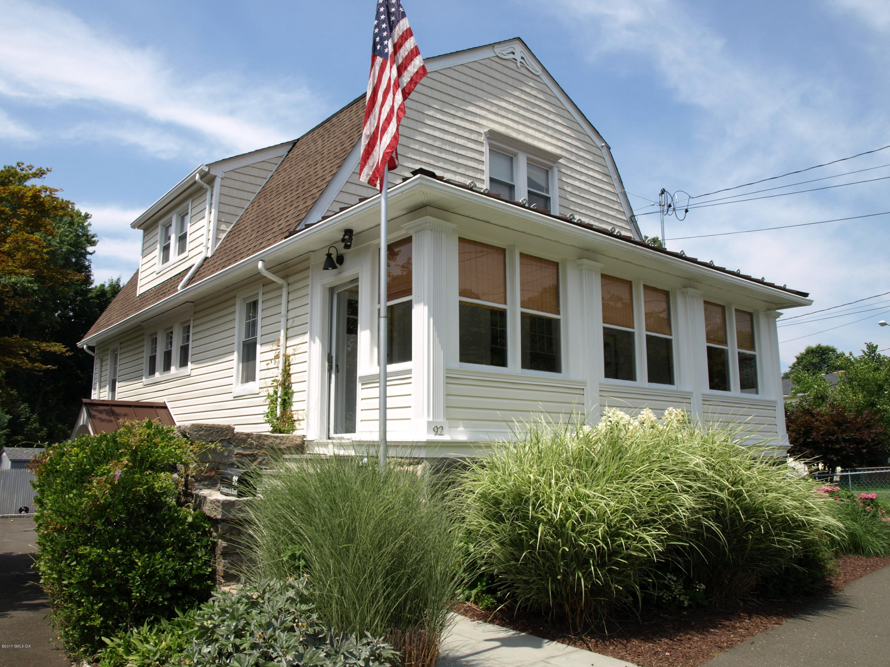 92 Pemberwick Road Greenwich, CT 06831 - Photo 1 of 2 a view of a house with a yard