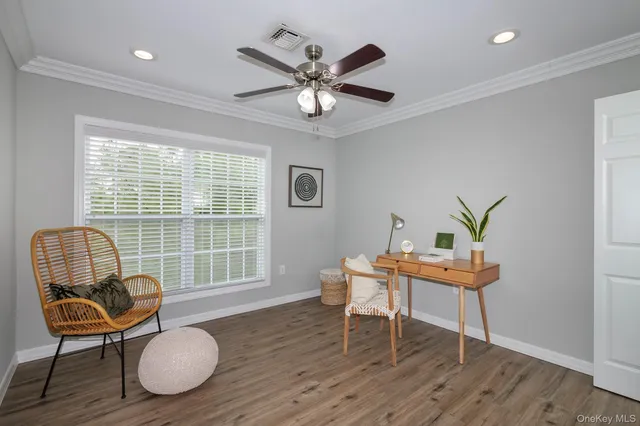 a work room with furniture and wooden floor