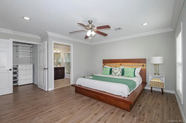 a bedroom with a bed and a view of bedroom