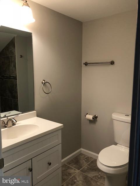5 Patapsco Road Linthicum, MD 21090 - Photo 12 of 20 a bathroom with a granite countertop toilet sink and mirror