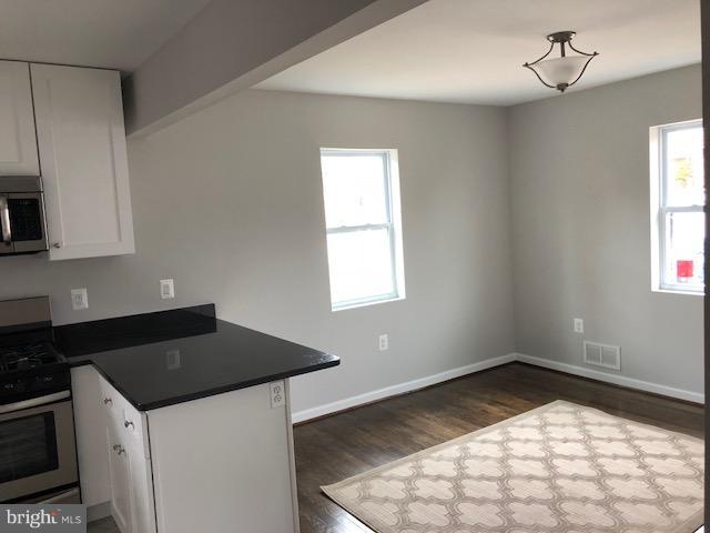 5 Patapsco Road Linthicum, MD 21090 - Photo 6 of 20 a kitchen with a stove a sink and a window