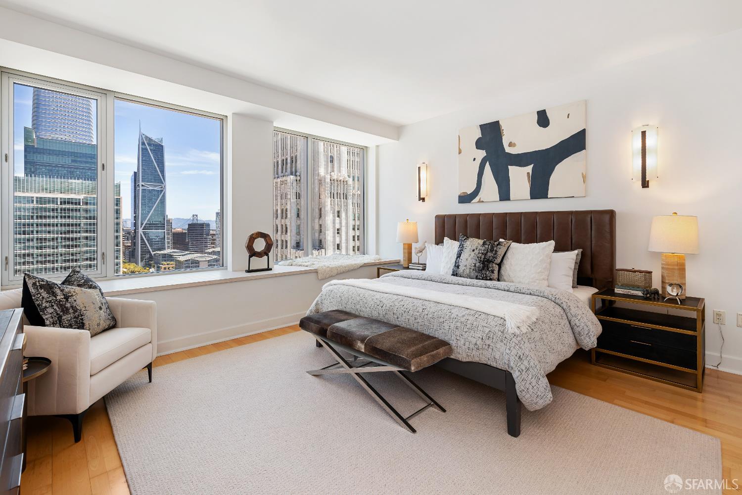 188 Minna, Unit 24A San Francisco, CA 94105 - Photo 15 of 43 a spacious bedroom with a bed and large windows