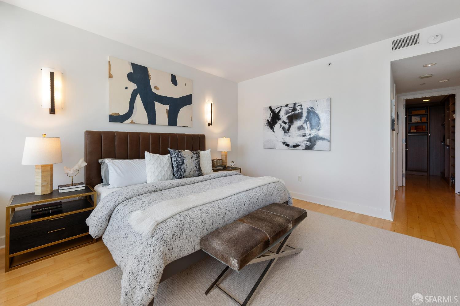 188 Minna, Unit 24A San Francisco, CA 94105 - Photo 17 of 43 a bedroom with a bed and wooden floor