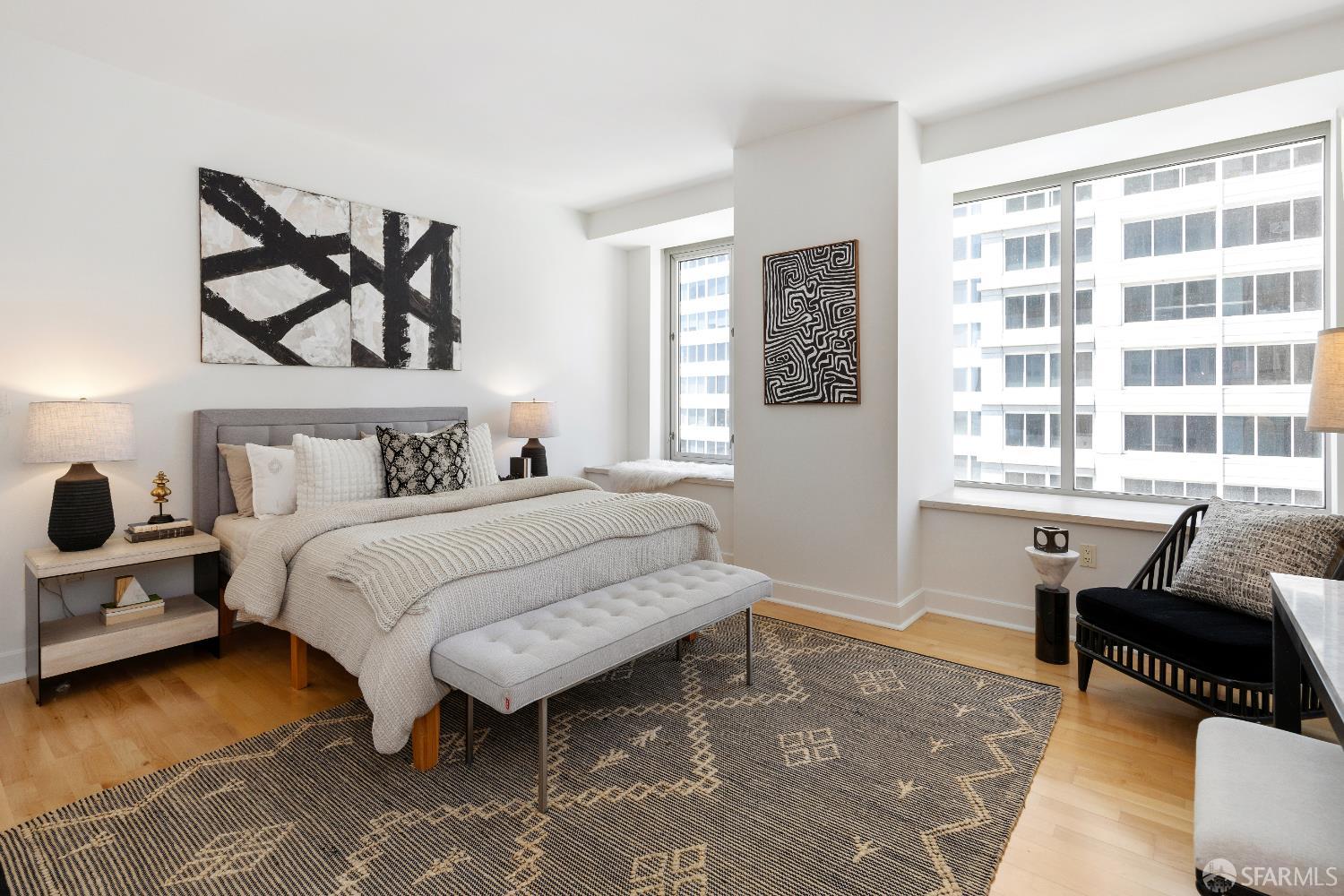 188 Minna, Unit 24A San Francisco, CA 94105 - Photo 20 of 43 a bedroom with a bed and wooden floor