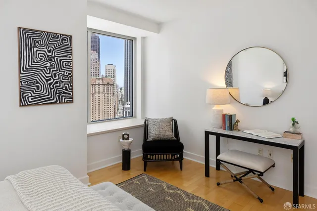 a bedroom with a bed and lamp