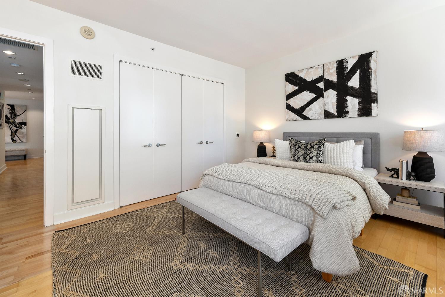 188 Minna, Unit 24A San Francisco, CA 94105 - Photo 22 of 43 a bedroom with a bed and lamp