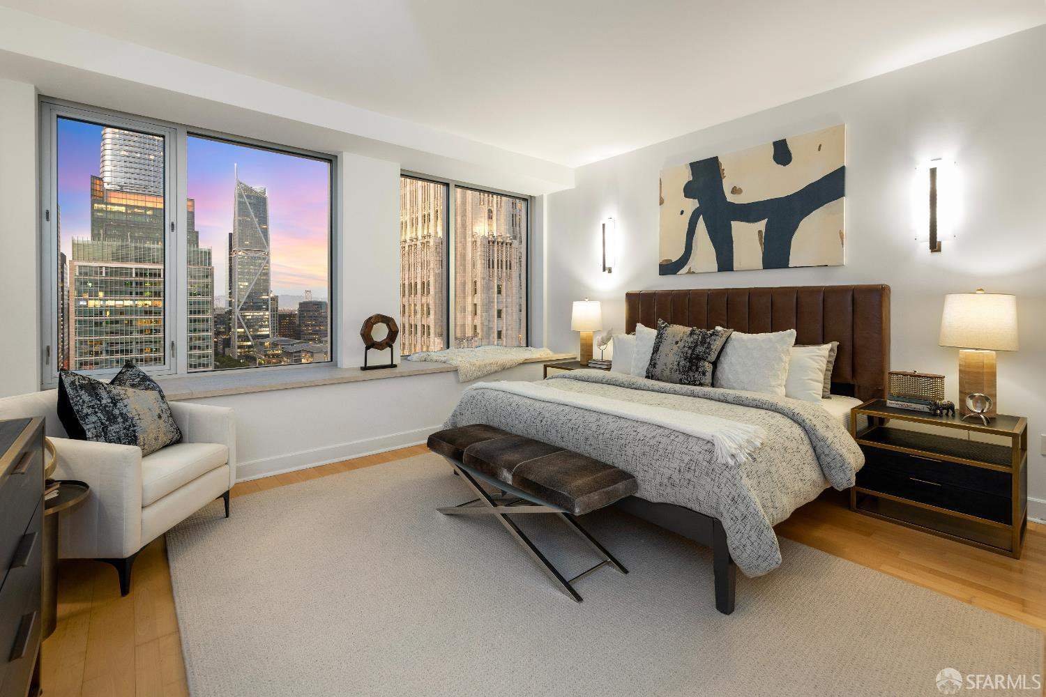 188 Minna, Unit 24A San Francisco, CA 94105 - Photo 3 of 43 a spacious bedroom with a bed and large windows