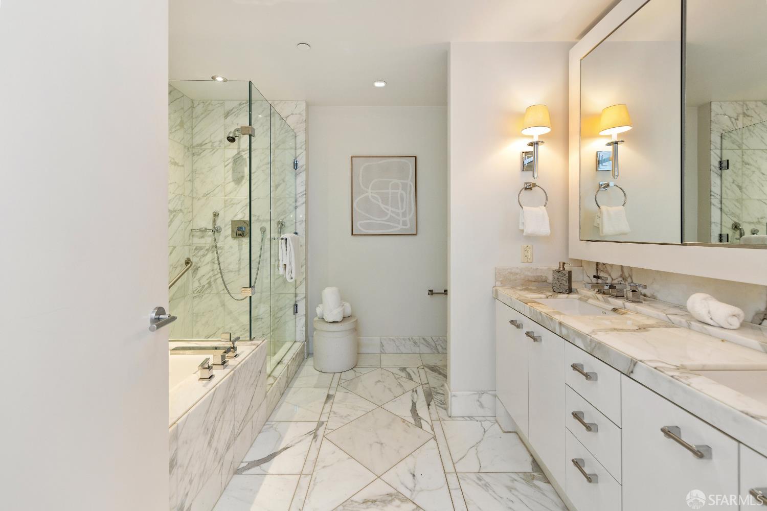 188 Minna, Unit 24A San Francisco, CA 94105 - Photo 5 of 43 a spacious bathroom with a shower sink and mirror