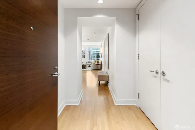 a view of living room with furniture and wooden floor