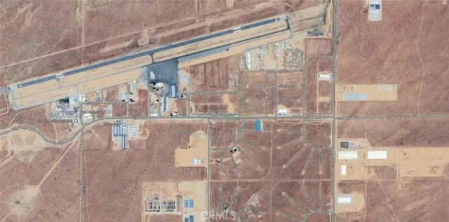 a bathroom with a granite countertop shower a mirror and a sink