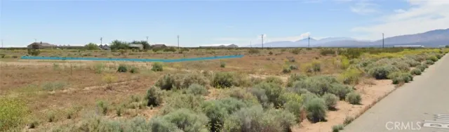 a view of a lake with houses in the background