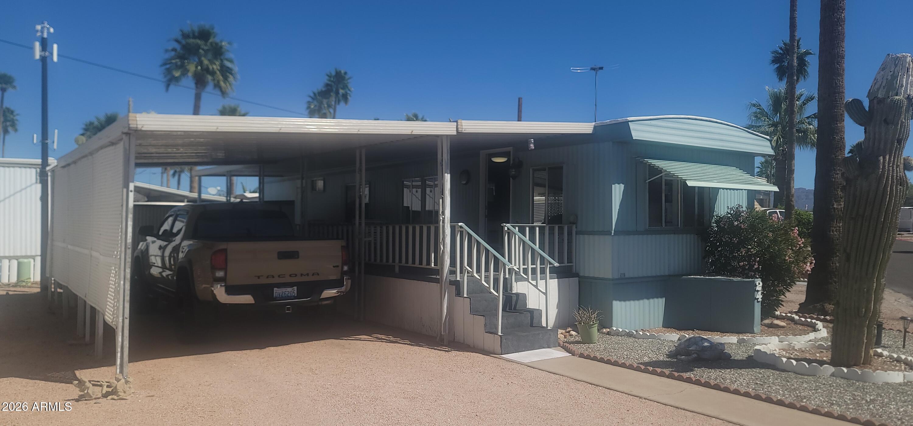 800 West Apache Trail, Unit 24 Apache Junction, AZ 85120 - Photo 2 of 11 a view of a porch with furniture