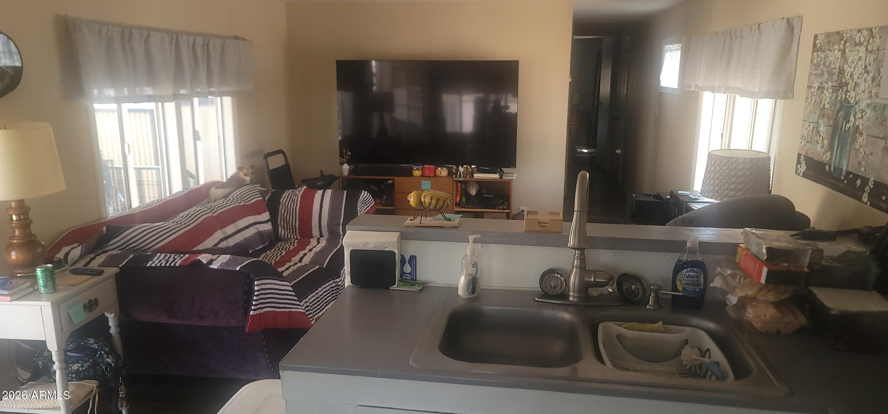 800 West Apache Trail, Unit 24 Apache Junction, AZ 85120 - Photo 4 of 11 a living room with furniture window and a wooden floor