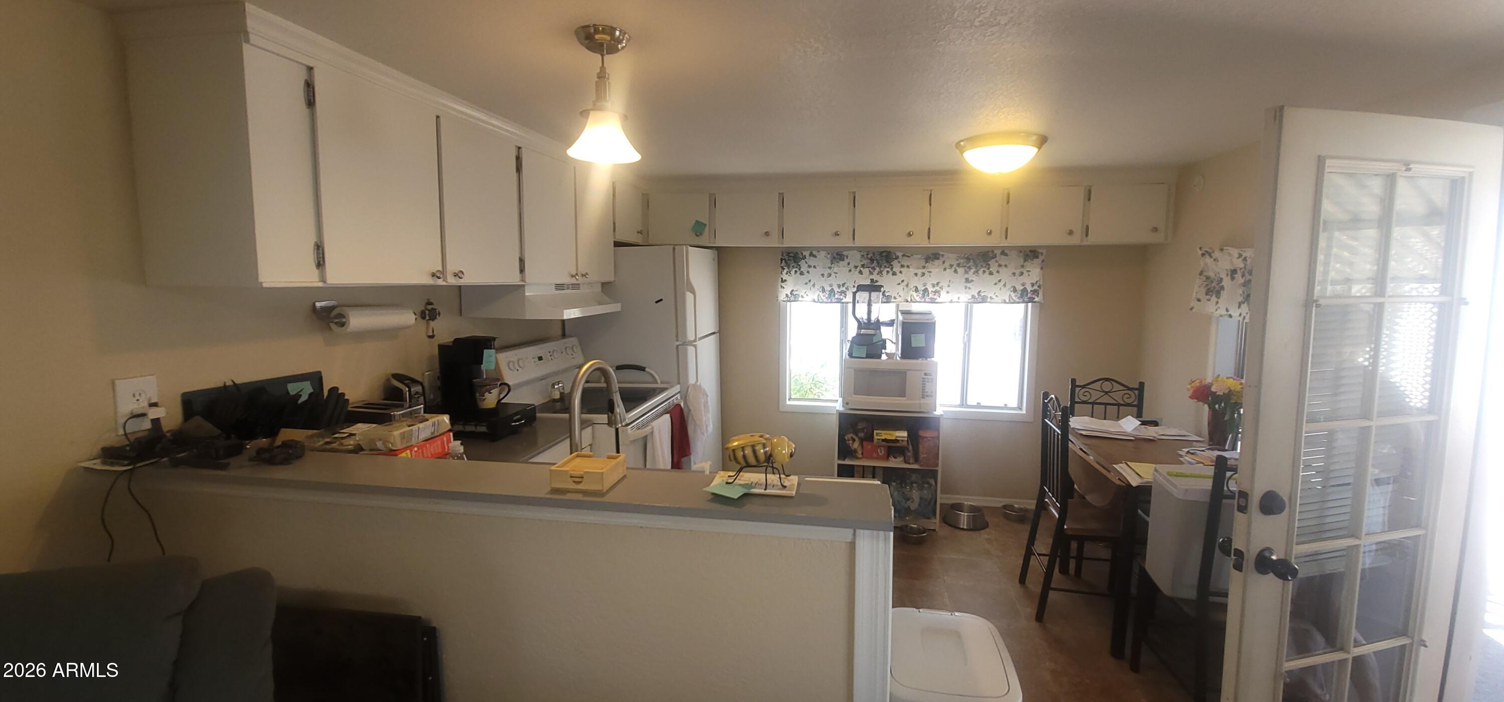 800 West Apache Trail, Unit 24 Apache Junction, AZ 85120 - Photo 6 of 11 a kitchen with refrigerator and window