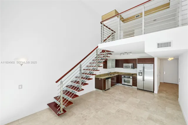 a view of a kitchen with a sink