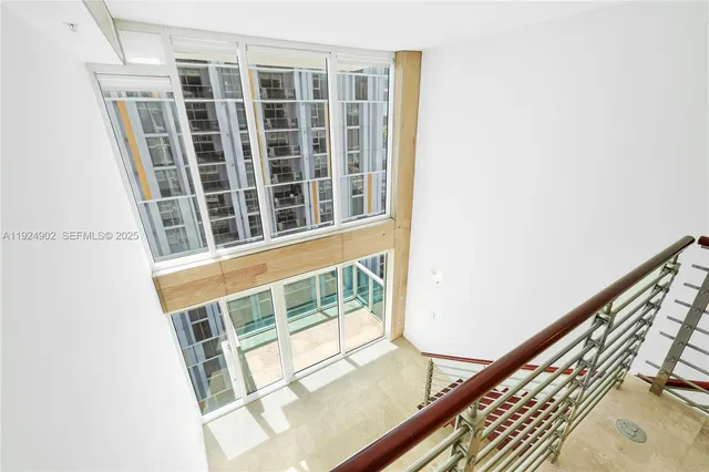 a view of a lake with a yard and a large trees