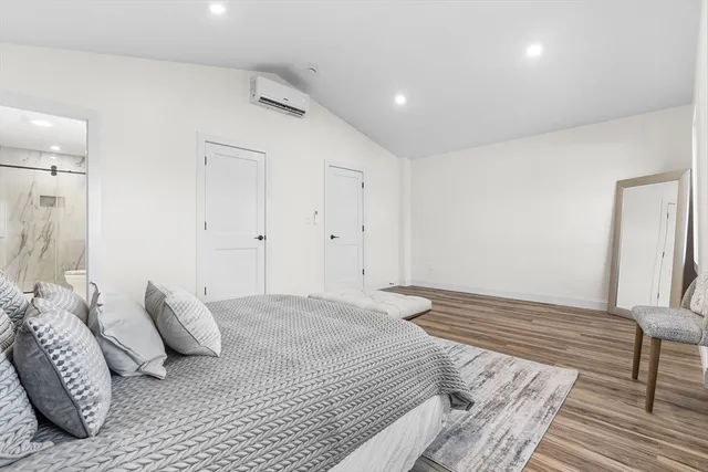 a bathroom with a double vanity sink toilet and shower