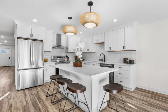 a kitchen with a sink stainless steel appliances and cabinets