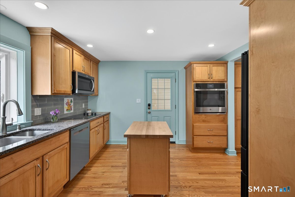 1006 King Road Cheshire, CT 06410 - Photo 5 of 40 The kitchen has a side door for convenient access to the garage.