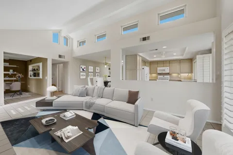 a view of an empty room with windows