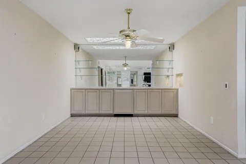a kitchen with a stove sink and a refrigerator