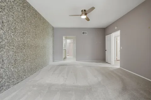 a view of a hallway with a window