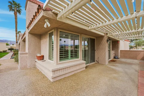 a view of an house with a large window and porch