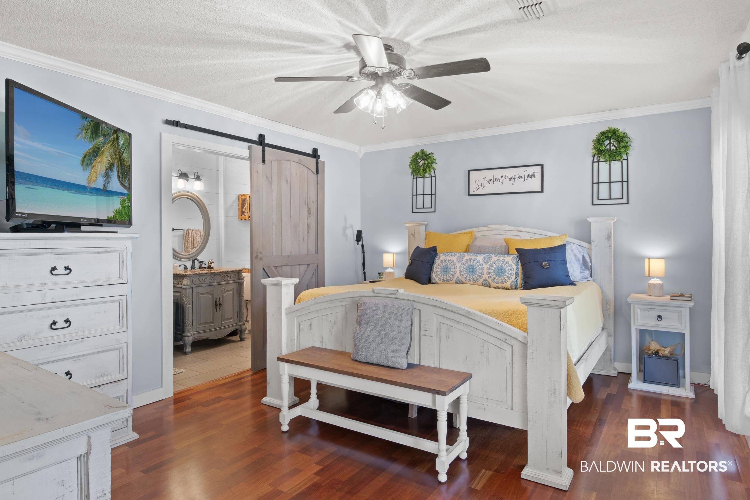 131 Marikesh Drive Daphne, AL 36526 - Photo 11 of 29 Bedroom with ensuite bath, ornamental molding, dark hardwood / wood-style flooring, ceiling fan, and a barn door