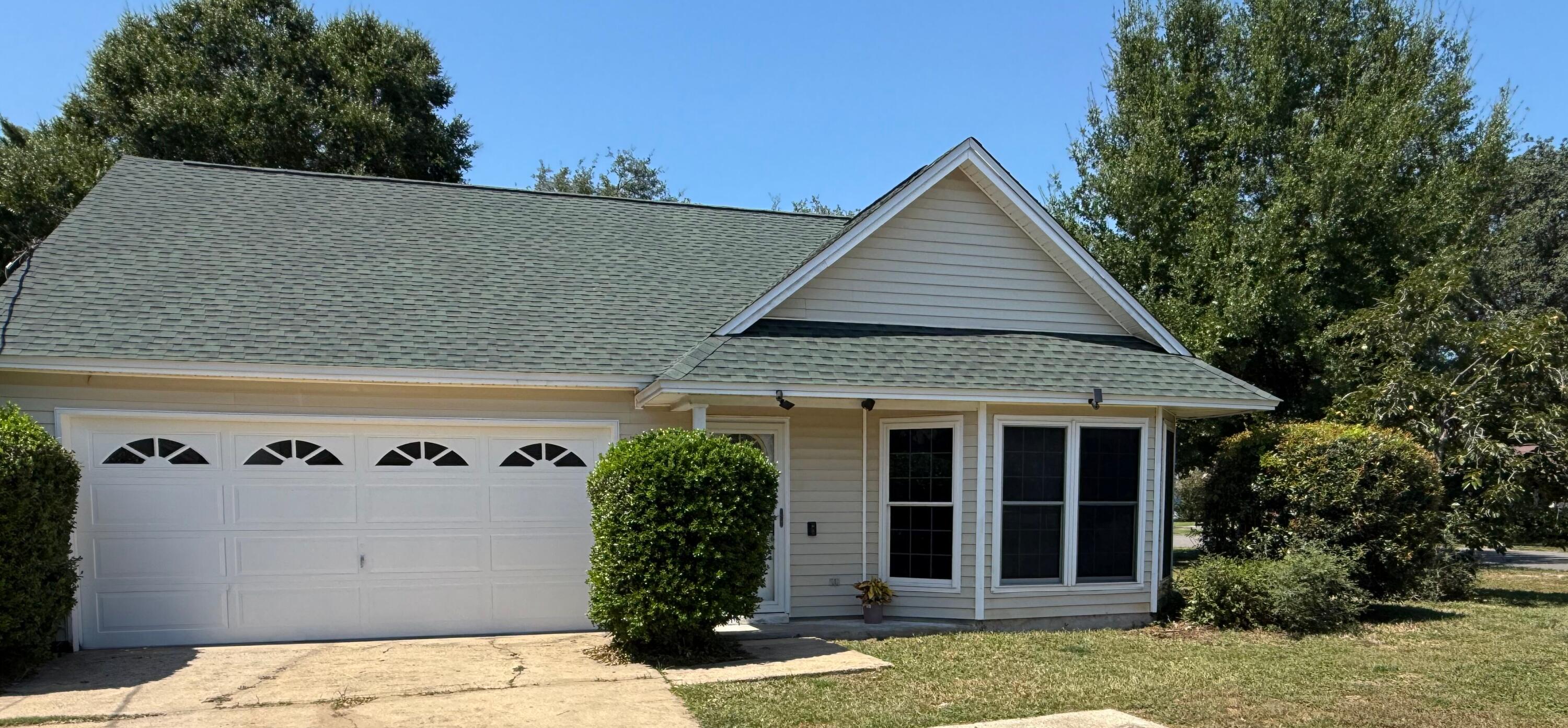 910 Elizabeth Lane Shalimar, FL 32579 - Photo 15 of 16 a front view of a house with garden