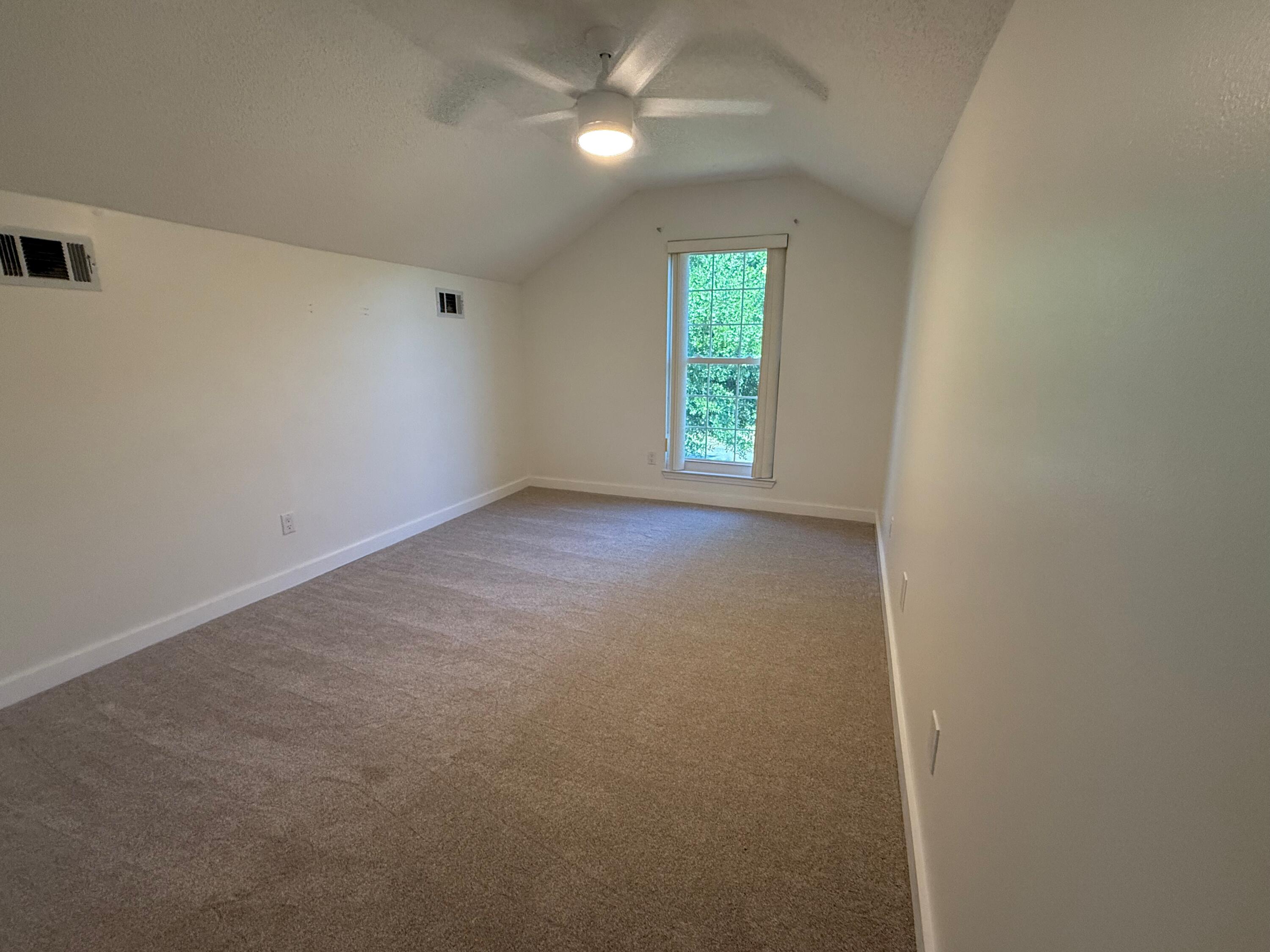 910 Elizabeth Lane Shalimar, FL 32579 - Photo 4 of 16 an empty room with windows